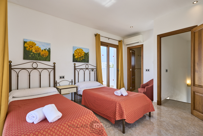 Twin bedroom at Cala Dia