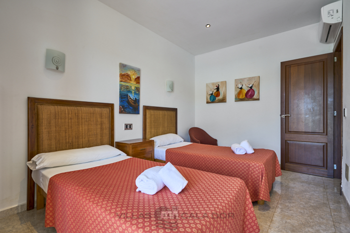 Twin bedroom at Cala Dia
